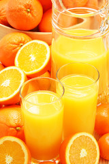 Composition with glasses of orange juice and fruits