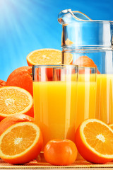 Composition with glasses of orange juice and fruits