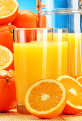Composition with glasses of orange juice and fruits