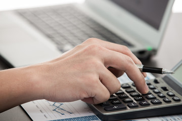 Businessman analyzing investment charts