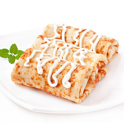 Pancakes stuffed with cottage cheese and sour cream