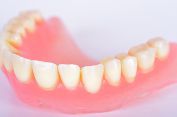 False teeth in glass