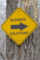 Business Solutions Arrow Sign on Tree