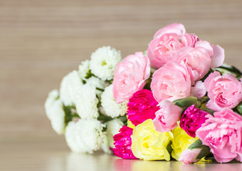 Carnations on wood background