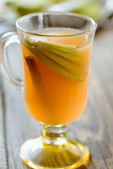 Fresh apple juice with  apple slices and cinnamon stick