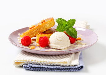 Almond cake with ice cream and raspberries