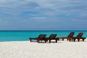 Relaxing chairs in front of the Indian Ocean in Maldive Islands