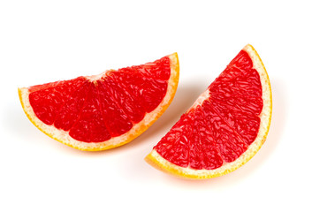 Fototapeta na wymiar cut red grapefruit isolated on white