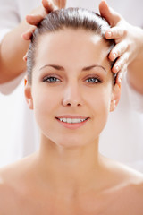 Naklejka premium Young beautiful woman in spa environment