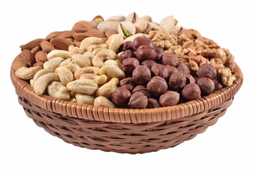 Assorted nuts in a wicker bowl on a white background