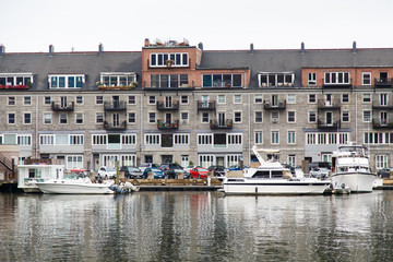 Fototapeta na wymiar Nice Boats Docked by Old Hotel