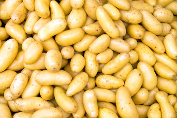 Clean potatoes on a market