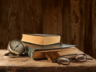 Vintage book, glasses and watches on the background of a wooden - 59889921