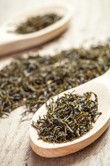 Spoons with green tea herbs