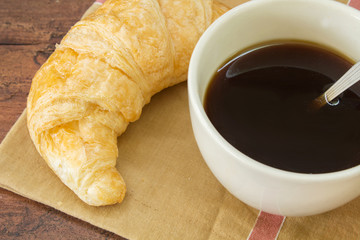Croissant with black coffee
