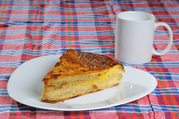 Homemade pie with cup of yogurt