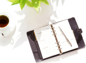 notebook and coffee cup