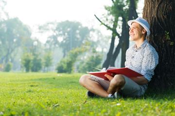 young man reading a book