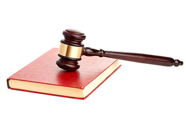 Judge's gavel on red legal book