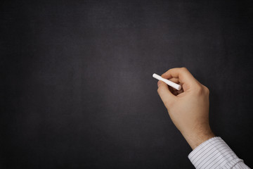 Hand writing on a blackboard