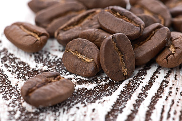 Coffee beans on wood background