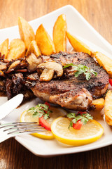 Fried pork chop with mushrooms