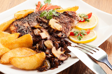 Fried pork chop with mushrooms