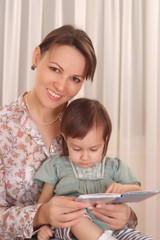 Mom and daughter reading