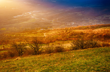 Fototapeta na wymiar Rural landscape with sun rays