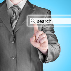 Businessman pushing virtual search bar