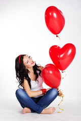 valentine's day beautiful young woman with red balloons