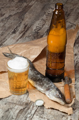 Two dry fish on wrapping paper