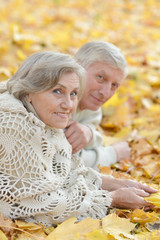 Portrait of a happy mature couple lying