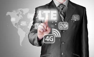 businessman is pushing his finger on lte button
