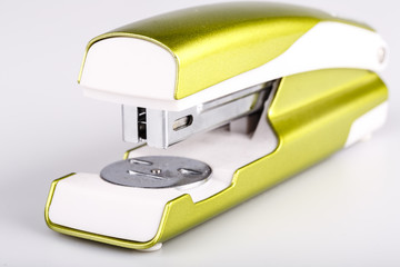 Light green stapler isolated on white