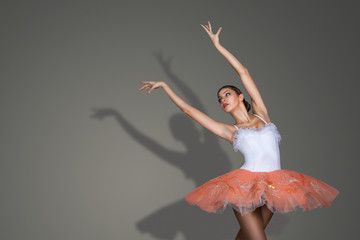 Graceful slender ballerina dancing