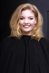 Fototapeta premium Beautiful blond girl client by hairdresser in hair beauty salon