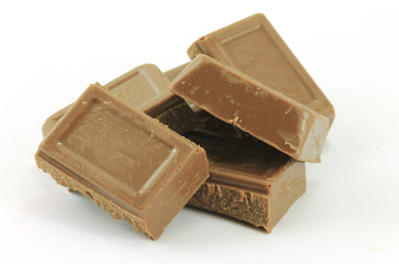 Chocolate pieces isolated on white background