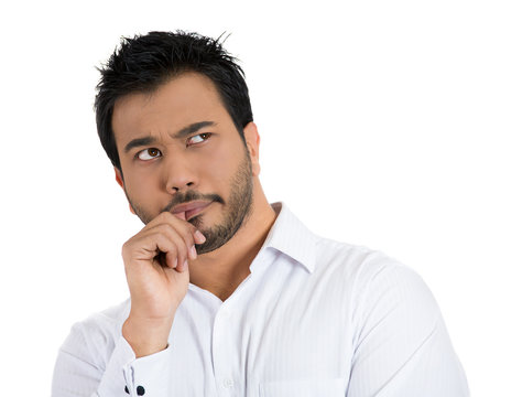 Clueless, worried man sucking up his thumb, daydreaming
