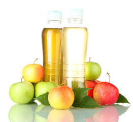 two bottles of juice with sweet apples, isolated on white