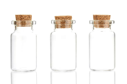 Empty little bottles with cork stopper isolated on white
