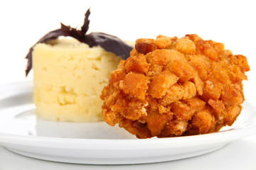 Chicken Kiev  and mashed potatoes on plate, isolated on white