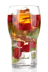 Iced tea with raspberries and mint isolated on white