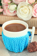 Cup with knitted thing on it close up