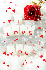 Candles with printed sign I LOVE YOU,on white fabric background