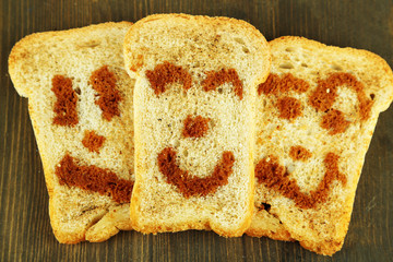 Funny toasts, on wooden background