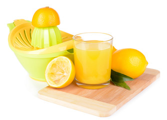 Citrus press and lemons isolated on white