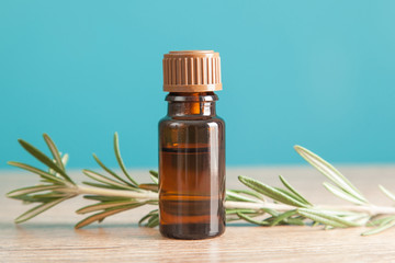 Bottle with aromatic oil and rosemary