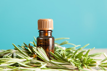 Bottle with aromatic oil and rosemary