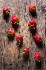 Fresh strawberries on old wooden background